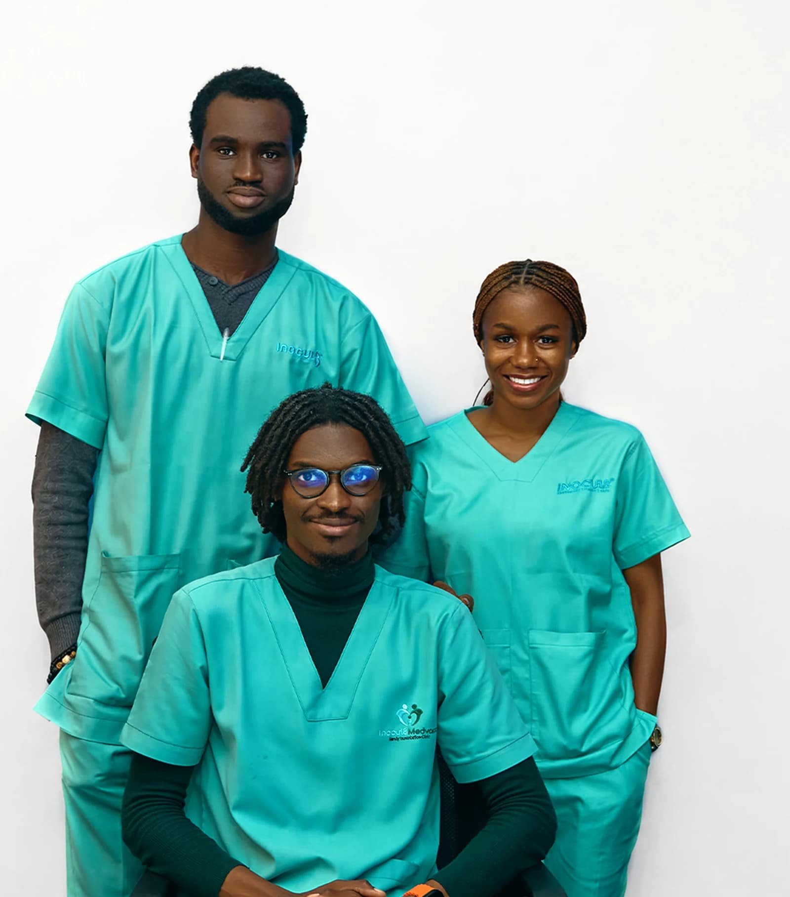 The Inocul8 clinic team — licensed vaccinators in branded scrubs