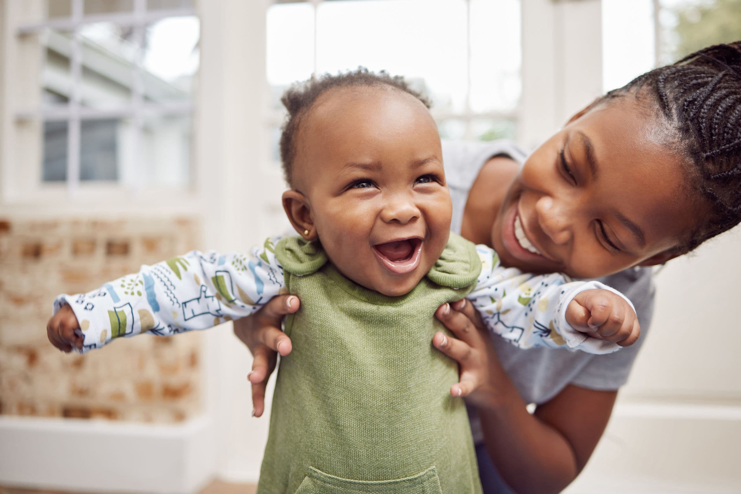 A-smiling-baby-with-her-mum