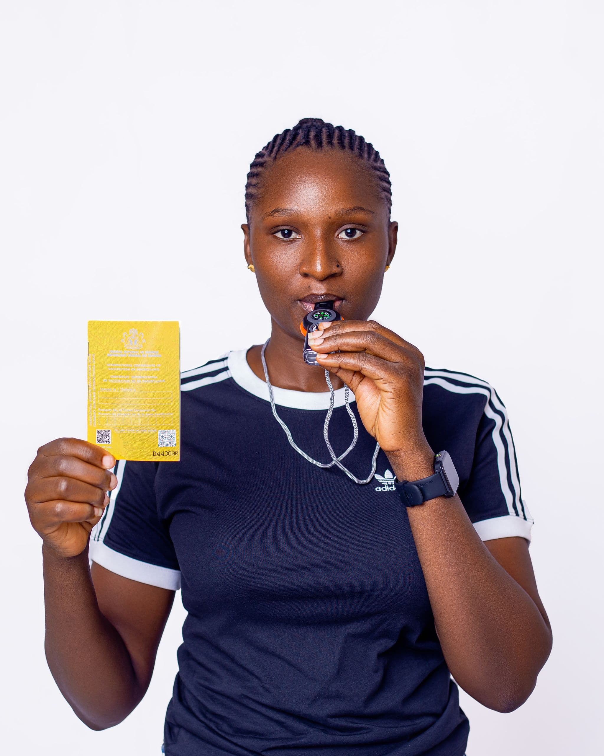 A-young-lady-displays-her-yellow-card-for-travel