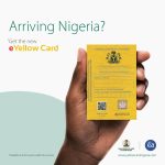 Sample of the original Nigeria e-Yellow Card held in hand showing security features like the QR code and holographic seal to distinguish it from fakes.